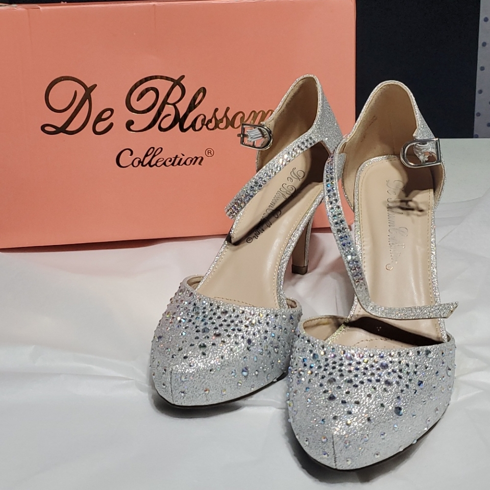 De Blossom sparkly, silver shoes.